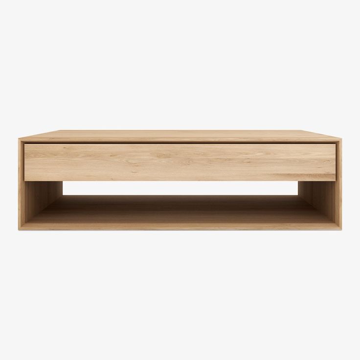 a wooden coffee table sitting on top of a white wall