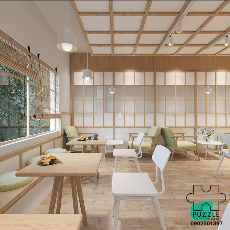 the interior of a japanese restaurant with wood paneling and white chairs, tables and benches