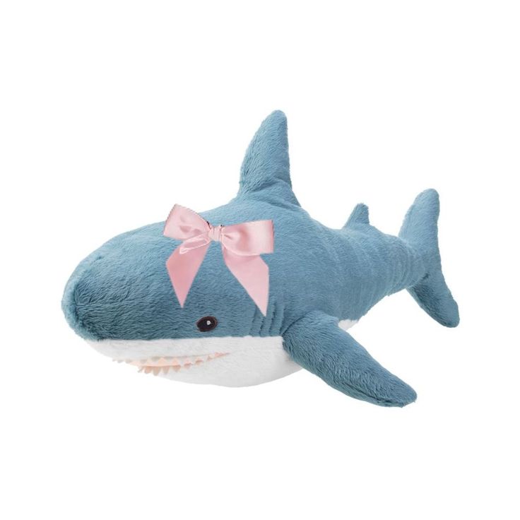 a stuffed shark with a pink bow on it's head is shown against a white background