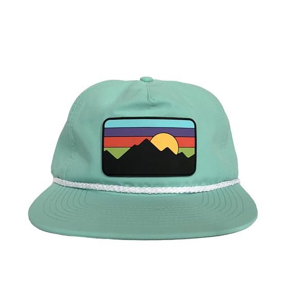 A 5 panel, unstructured snapback cap perfect for your next adventure. Made with a waterproof, durable, all-weather fabric and featuring a PVC/Rubber patch, this hat will not only have you looking fresh, but ready for anything as you head out into the wild. Features a pliable brim for shaping the look you want and an adjustable snap back closure. Casual Six-panel Snapback Hat For Hiking, Green 5-panel Snapback Hat For Beach, Green Snapback Hat With Logo Patch For Outdoor, Camping Snapback Baseball Cap With Logo Patch, Snapback Baseball Cap With Logo Patch For Camping, Snapback Baseball Cap With Logo Patch For Outdoor, Green Trucker Hat With Flat Brim For Camping, Green Trucker Hat With Flat Bill For Outdoor, Outdoor Baseball Cap With Logo Patch And Flat Bill