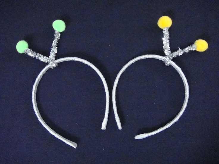 two white headbands with yellow and green beads