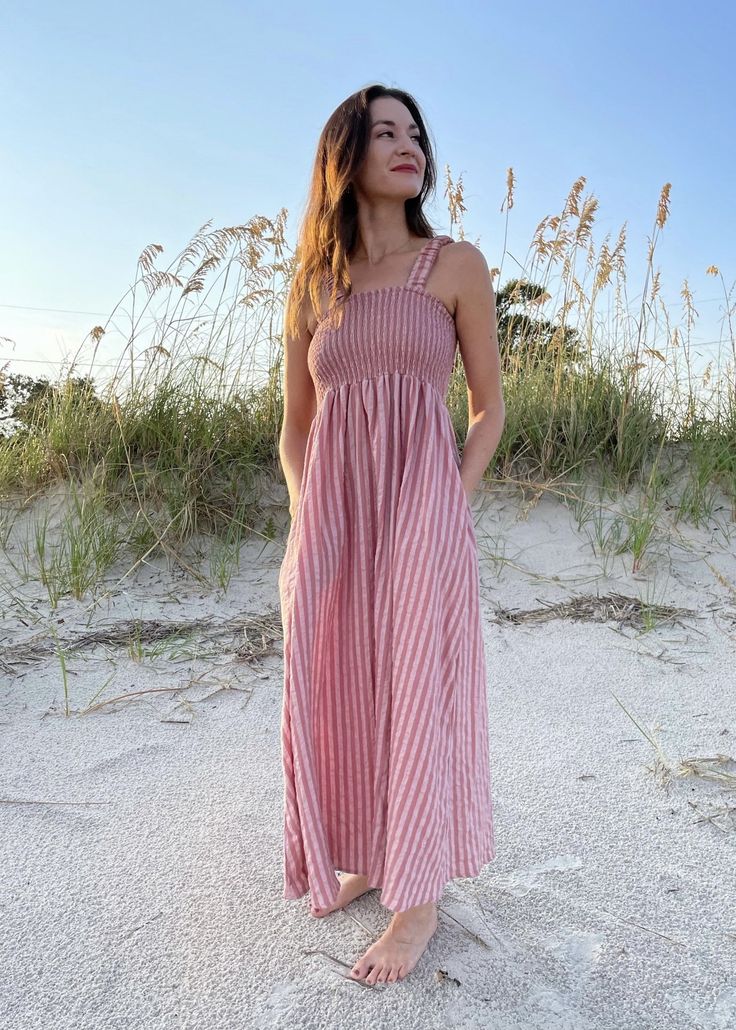 Striped Mauve Smocked Cotton Dress Crushing on this dress! So comfortable and easy to wear. It's lightweight so perfect for end of summer & a great transition color into early fall. Not to mention it has pockets! Product Details: Color: Mauve Striped Smocking detail Tank style dress Side pockets Cropped ankle length Fitted top Easy to wear, comfy Runs true to size, 5'4 wearing a small 100% Cotton Fitted Top, Smocked Dress, Early Fall, End Of Summer, Large Size Dresses, Hat Hairstyles, Cotton Dress, Style Dress, Striped Dress