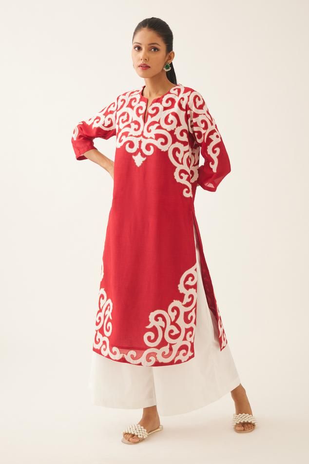 Red silk chanderi straight kurta with cotton applique work at neck, hem and sleeves, highlighted with kantha hand work. Comes with off white cotton wide leg pant with side pockets. 
Components: 2
Pattern: Embroidered
Type Of Work: Trellis Jaal Appliques
Neckline: Notched
Sleeve Type: Three Quarter
Fabric: Silk Chanderi, Pant and Lining- Cotton
Color: Red
Other Details: 
Lined kurta and pant
Side pocketed kurta and pant
Back elasticated pant
Closure: Pant: Front drawstrings
Occasion: Work,Puja - Red Block Print Kurta For Designer Wear, Designer Red Block Print Kurta, Red Block Print Kurta For Transitional Season, Transitional Red Block Print Kurta, Red Block Print Traditional Wear For Navratri, Red Block Print Straight Kurta, Red Straight Kurta With Block Print, Red Chanderi Block Print Sets, Red Cotton Palazzo Set With Traditional Drape