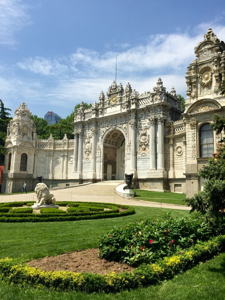 a large building with a garden in front of it