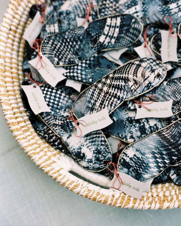 a basket filled with lots of fish on top of a white tablecloth covered floor