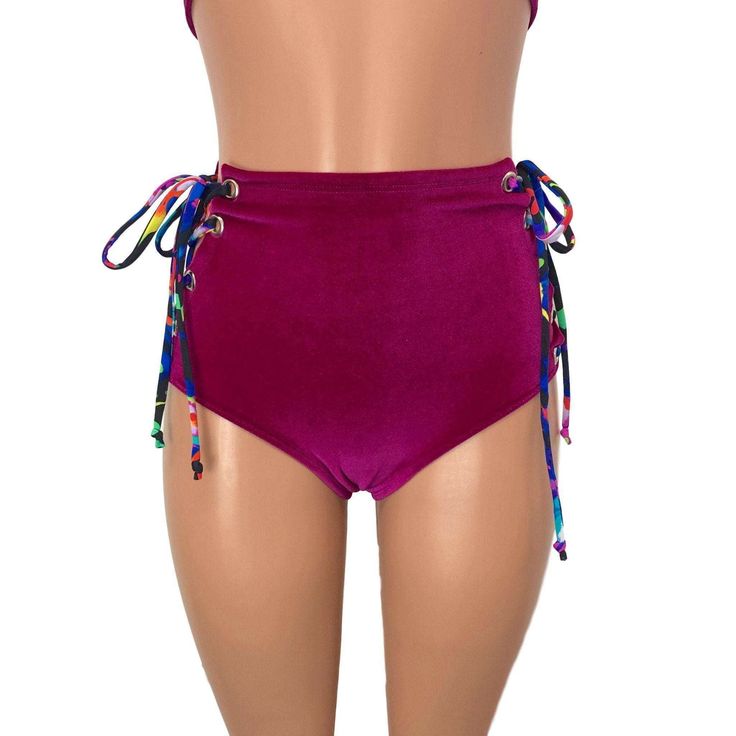 Our classic high waist hot pants with scrunch ruching detail in back to offer a "cheekier" look AND Lace-up sides! These hot pants are made of stretchy fuchsia velvet with splatter print ties and sit high on your natural waist. The lace-up sides make these more adjustable to fit you even better. Wear as a bikini bathing suit bottom, panties, rave shorts, etc. They have a built in liner and are made to be flattering to your figure. Trendy High Waist Bottoms For Pool, Tie-side Bottoms For Beach Season Parties, High Waist Beachwear Swimwear With Drawstring, High Waist Fitted Swimwear With Drawstring, Beachwear Bottoms With Drawstring For Festival, Fitted Tie-side Swimming Shorts, High Waist Drawstring Beachwear Bottoms, Beach Season Party Bottoms With Tie-side, Fitted High Waist Swimwear With Drawstring