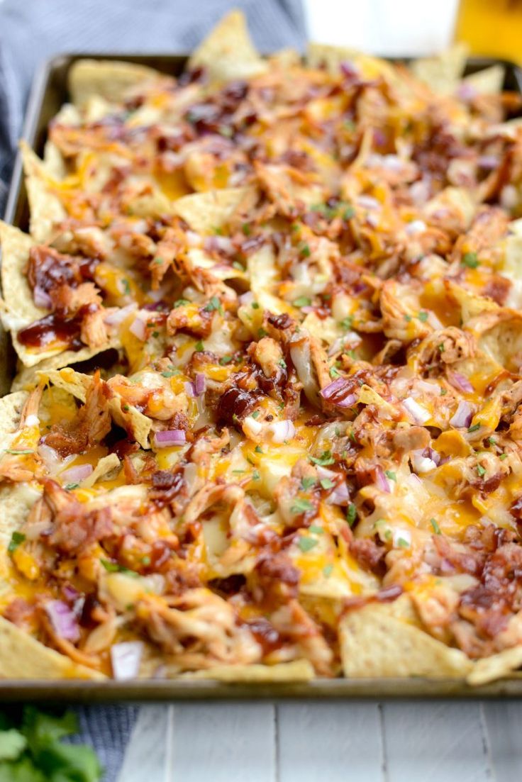 a tray filled with nachos sitting on top of a table