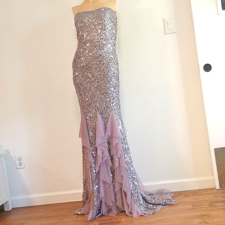 a dress on display in front of a white wall