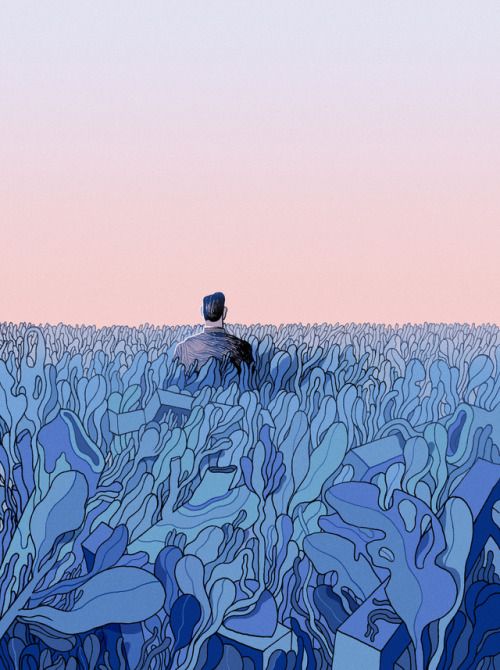 a man standing in the middle of a blue field