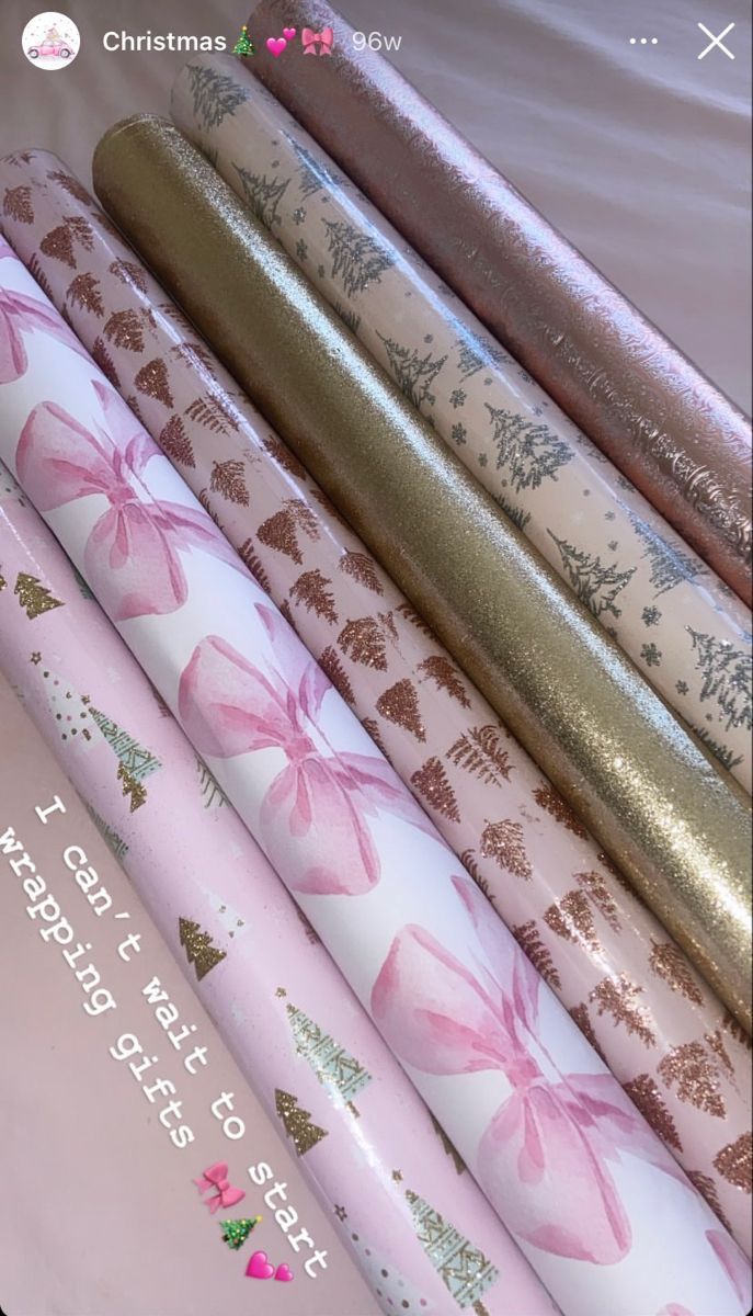 pink and gold wrapping paper with bows on them