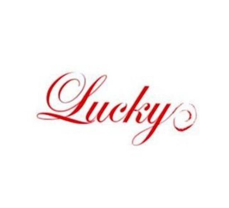 the word lucky is written in red ink on a white background with an ornate script