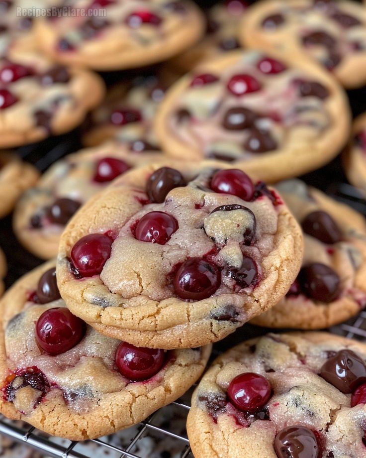 cookies with cherries and chocolate chips on a cooling rack