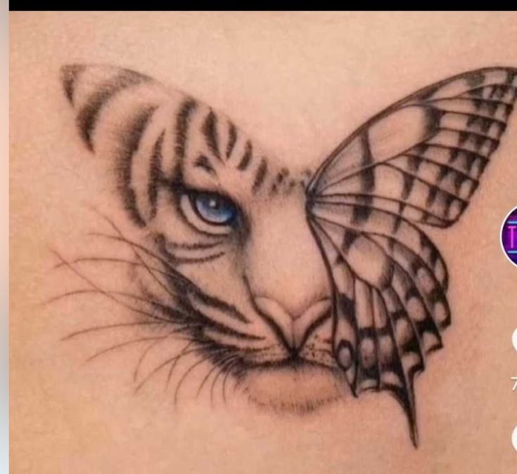 a close up of a tattoo with a tiger on it's chest and a butterfly on its back