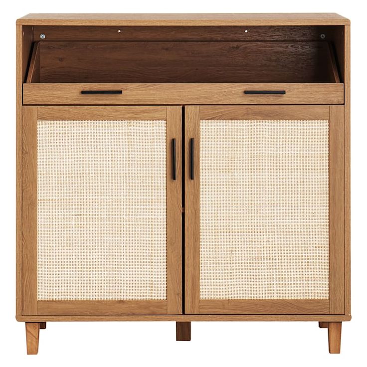 a wooden cabinet with two doors and wicker panels on the front, against a white background