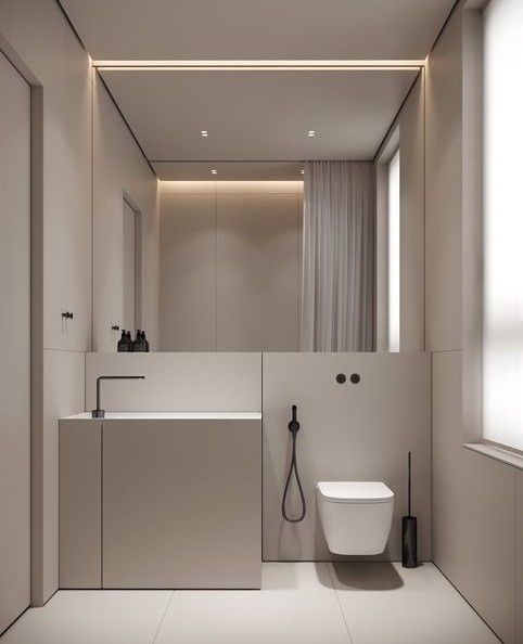 a bathroom with a toilet, sink and mirror