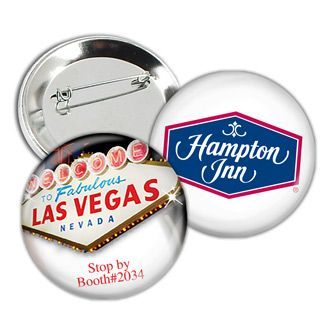 two button badges with the word las vegas and an image of a sign on it