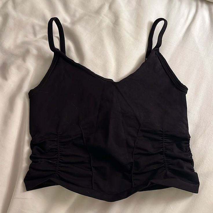 Free People Movement Top Athletic, Supportive Top Cropped With Corset Like Rouging Detail Black Spaghetti Straps - Not Adjustable Never Worn - New Condition Size Xs/S Black Ruched Tank Top For Party, Black Ruched Cami Top, Black Ruched Tank Top For Summer, Casual Black Ruched Tank Top, Black Cotton Bra-friendly Crop Top, Black Cotton Bra Friendly Crop Top, Bra Friendly Black Cotton Crop Top, Casual Black Crop Top With Built-in Bra, Black Cotton Crop Top Bra Friendly