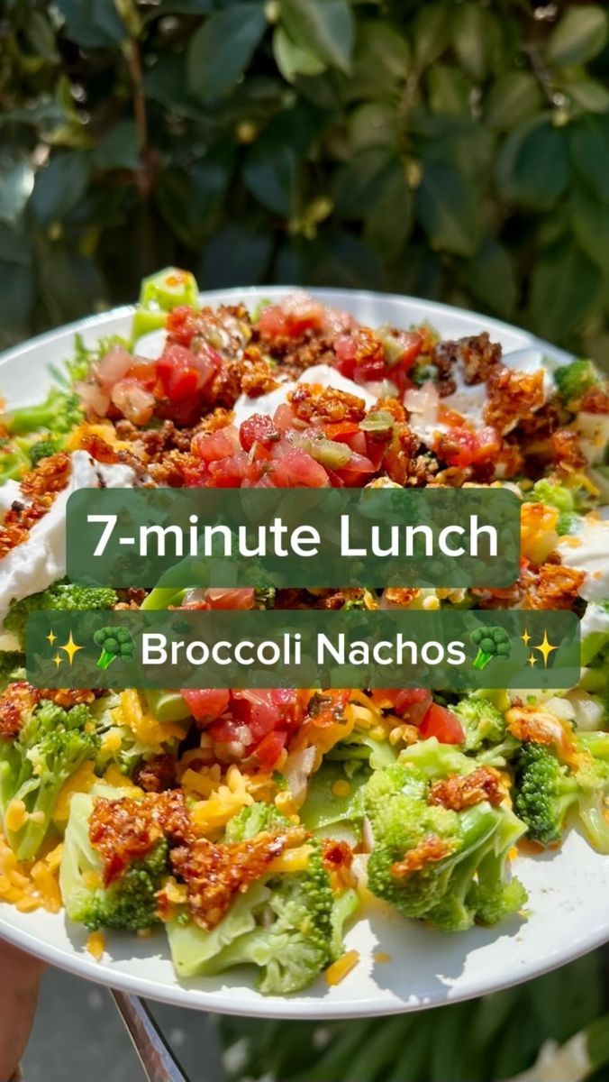 a white plate topped with broccoli and salad