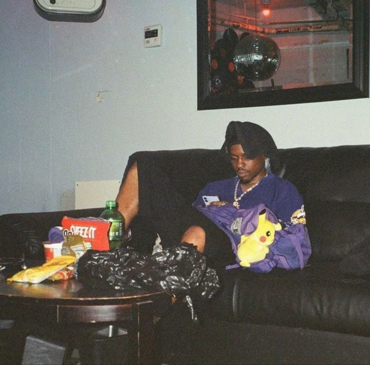 a person sitting on a couch in a living room