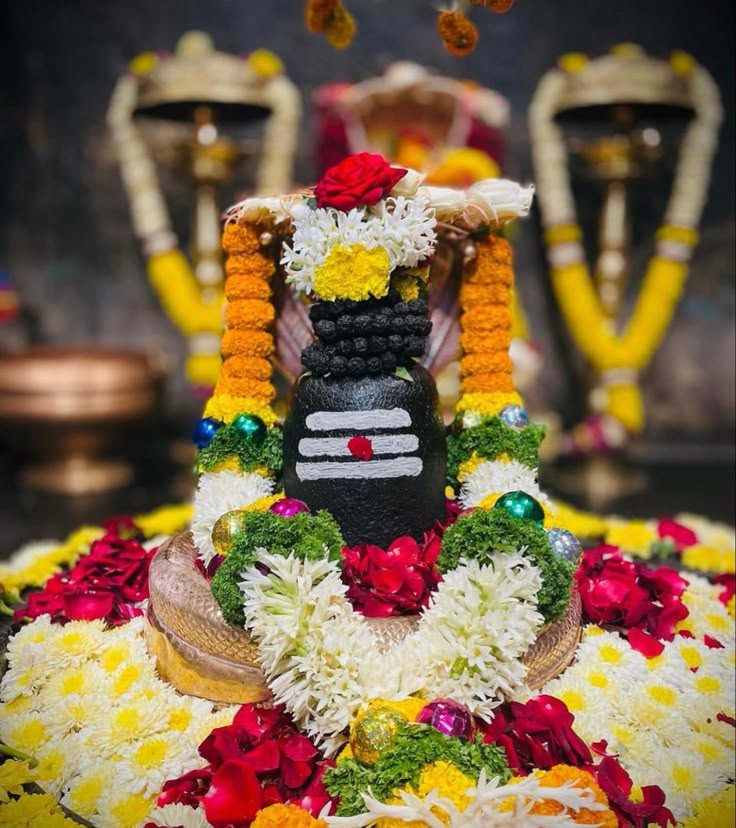 an idol is adorned with flowers and garlands