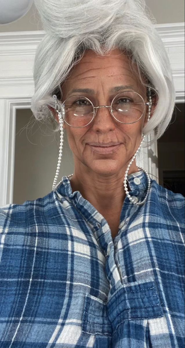 an older woman with white hair and glasses