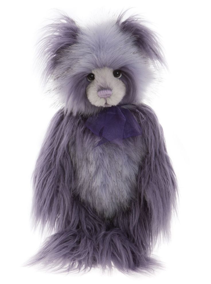 a stuffed animal with purple fur and a bow tie