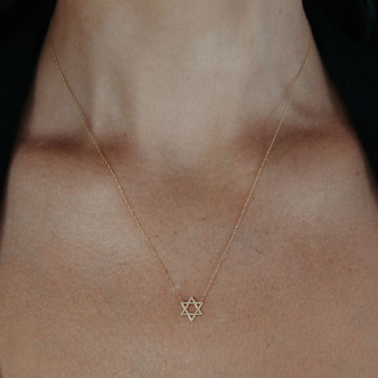 This high-polished 14K yellow gold Star of David pendant is the perfect go-to gift for your next Bar Mitzvah. 14K Yellow Gold Length: 18 Inches Minimalist 14k Gold Star Of David Necklace, Elegant 14k Gold Star Of David Jewelry, Dainty Star Of David Jewelry For Anniversary, Minimalist Yellow Gold Star Of David Necklace, Dainty Yellow Gold Star Of David Necklace, Star Of David Yellow Gold Plated Jewelry, Elegant Yellow Gold Star Of David Necklace, Silver Star Of David Necklace In 14k Gold, 14k Gold Silver Star Of David Necklace