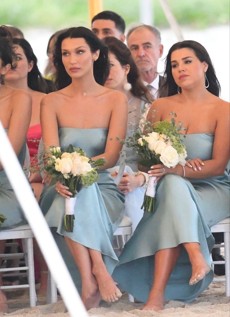 the bridesmaids are waiting for the groom to walk down the aisle