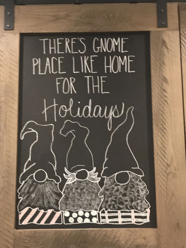 there is a chalk board with writing on it that says there's gnome place like home for the holidays