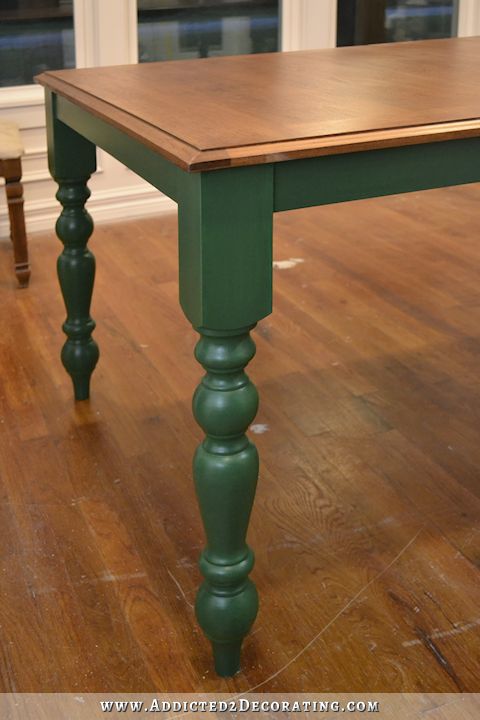 a wooden table sitting on top of a hard wood floor