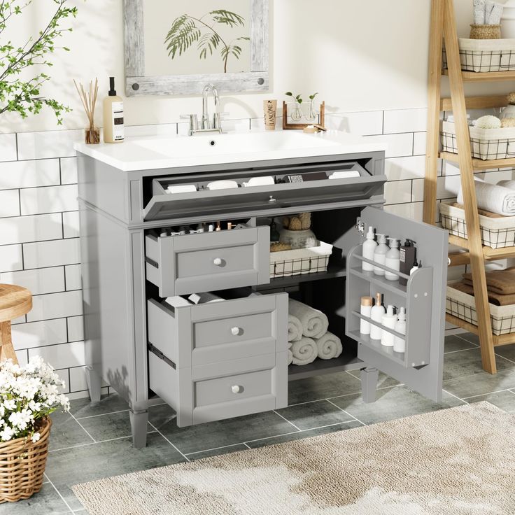 a bathroom vanity with drawers and baskets under it