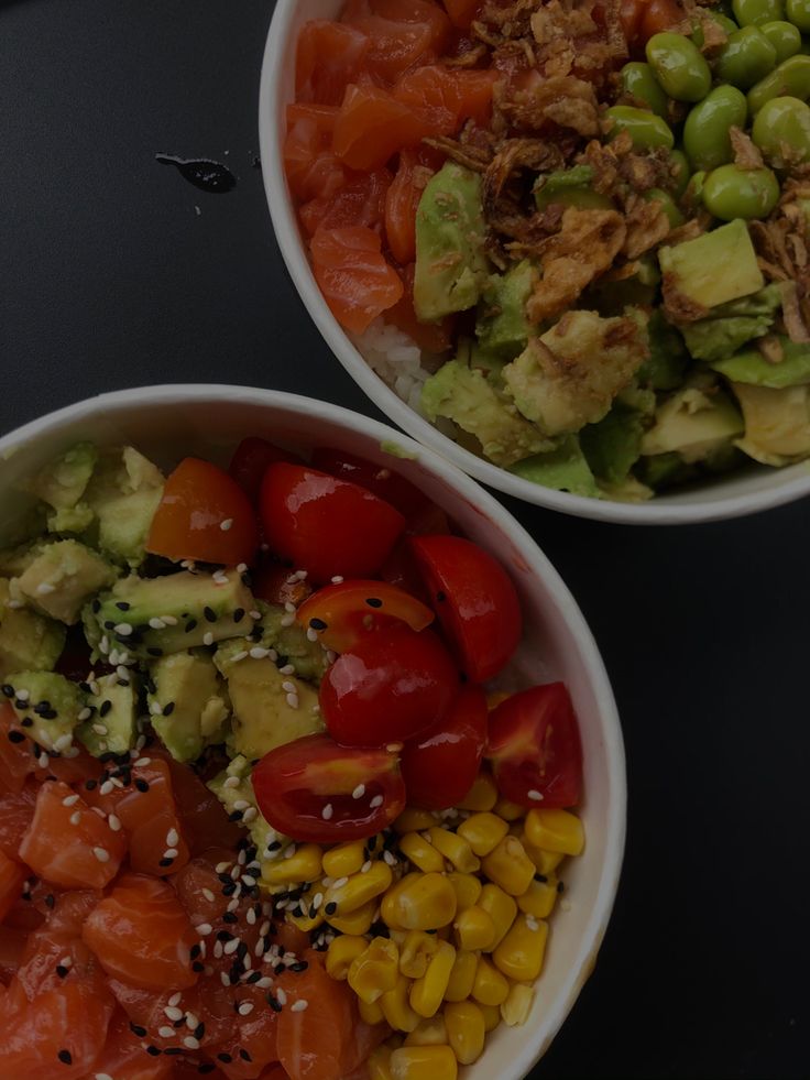 two bowls filled with different types of food