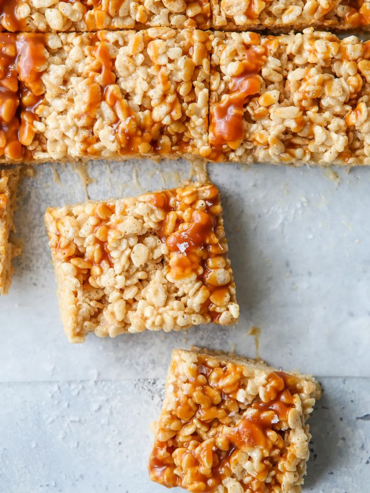 peanut butter granola bars cut into squares and stacked on top of eachother