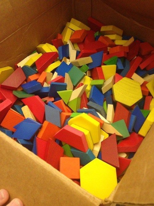 a box filled with lots of different colored blocks