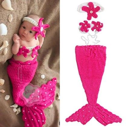 a baby mermaid doll laying on top of a bed next to an image of a pink crocheted mermaid tail