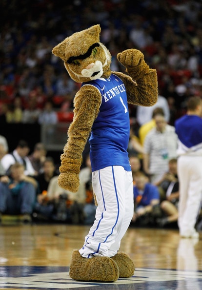 a mascot is standing on the basketball court