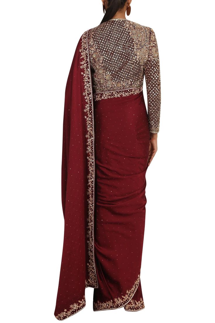 Maroon saree with floral motif work. Paired with matching blouse and petticoat.
Components:3
Sequin, bead and cutdana embellished,,zardozi embroidery
Neckline:Round
Sleeve Length:3/4th sleeves
Fabric:Satin
Color:Maroon
Closure: 
Blouse: Front hook - Aza Fashions Georgette Blouse Piece With Dabka Work For Reception, Fitted Pre-draped Saree With Dabka Work In Georgette, Long Sleeve Resham Embroidery Pre-draped Saree For Festive, Festive Pre-draped Saree With Dabka Work For Diwali, Bollywood Style Fitted Pre-draped Saree With Dabka Work, Designer Blouse With Dabka Work In Traditional Drape, Designer Semi-stitched Pre-draped Saree With Dabka Work, Festive Blouse Piece With Dabka Work, Traditional Drape, Floor-length Art Silk Saree With Dabka Work