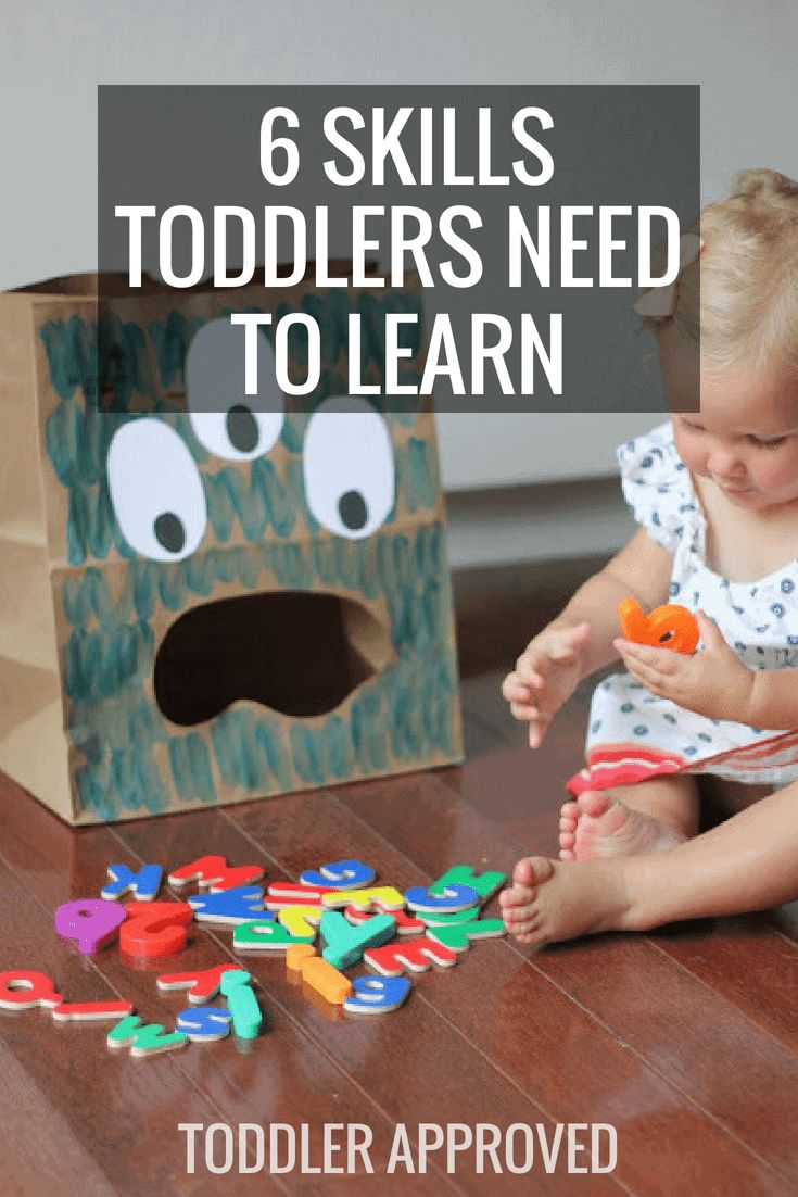 a toddler playing with toys on the floor in front of a cardboard box that says, 6 skills toddlers need to learn