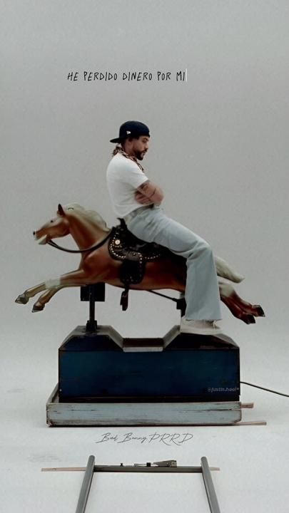 a man sitting on top of a horse statue