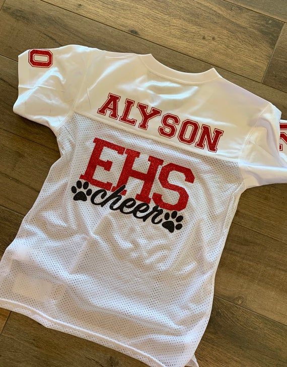 a white football jersey with the words, alyson ehs queens on it