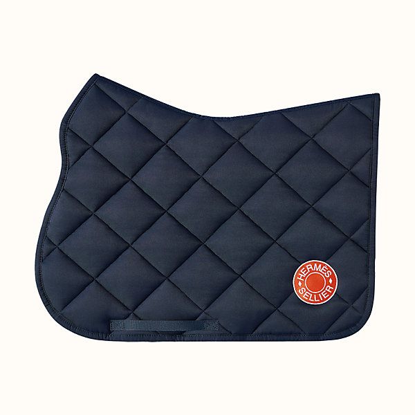 a black saddle pad with an orange emblem on the front and side, sitting on a white background