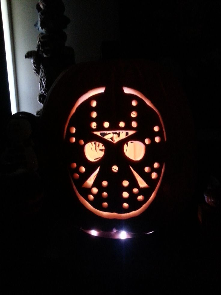 a pumpkin carved to look like a hockey wheel