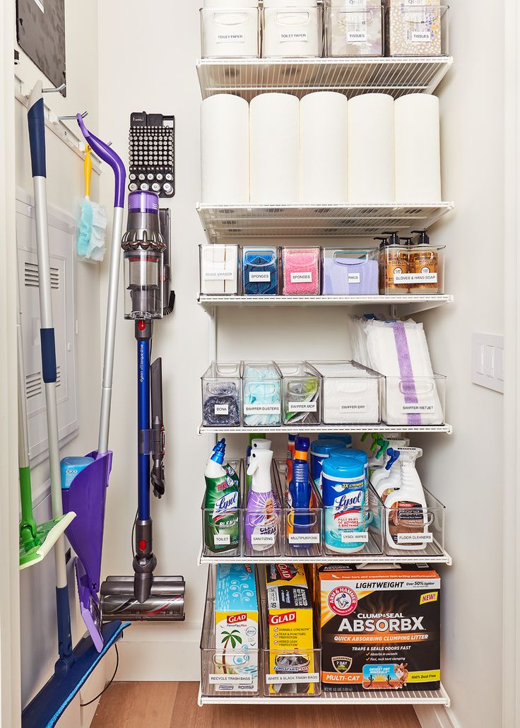 an organized pantry with cleaning supplies on shelves