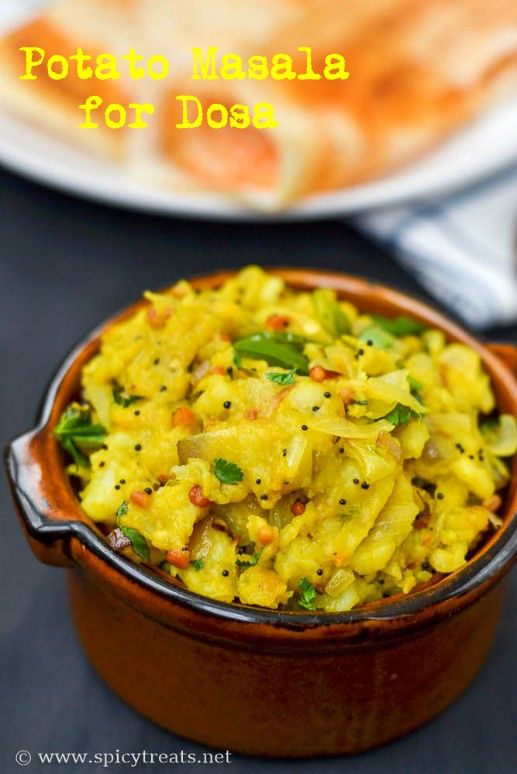 potato macaroni for dosa in a brown bowl on a black table with a white plate behind it