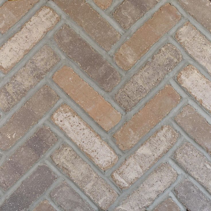 Natural stone like this beautiful Rushmore Thin Brick Herringbone Panel can create a high-value look in any living space. The 12 1/2 x 27 clay ledger features gray hues with a textured finish. Install it on a wall to create a focal point, or use it to elevate the look of your design. The Rushmore Thin Brick Herringbone Panel can add a beautiful touch to your space with its natural look and versatility. | Brickwebb | Rushmore Thin Brick Herringbone Panel, 12 1/2 x 27, Grey, 1/2 inch Thick - Floor & Decor Herringbone Tile Hallway, Brick Flooring Mudroom, Brick Floor Mudroom, Brick Herringbone, Old Mill Brick, Studio Remodel, Transitional Farmhouse, Brick Patio, Mud Rooms