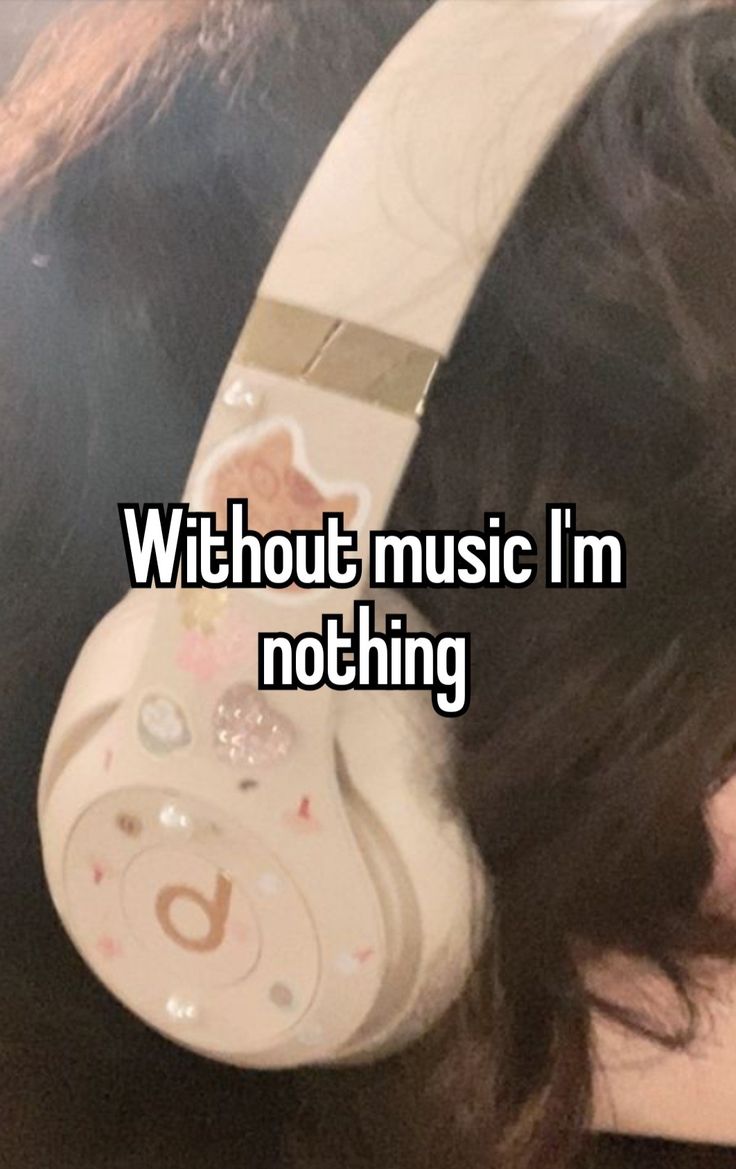 a woman wearing headphones with the words without music i'm nothing on it