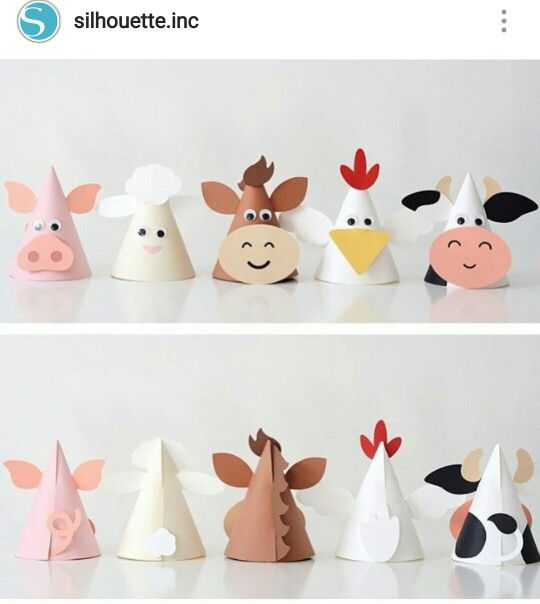 several paper hats with farm animals on them