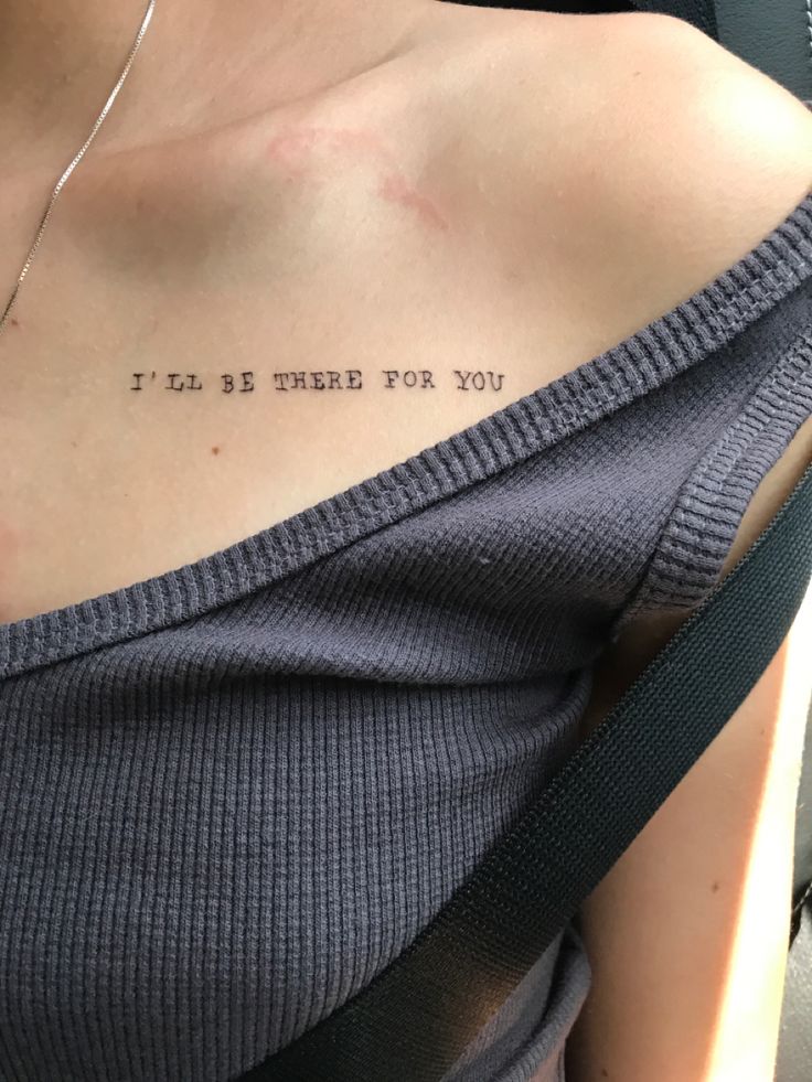 a woman with a tattoo on her chest saying i'll be there for you