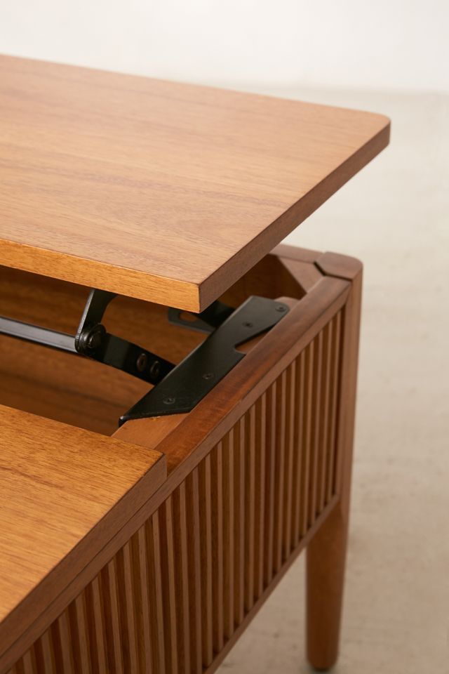 a close up of a wooden table with an open drawer on it's side