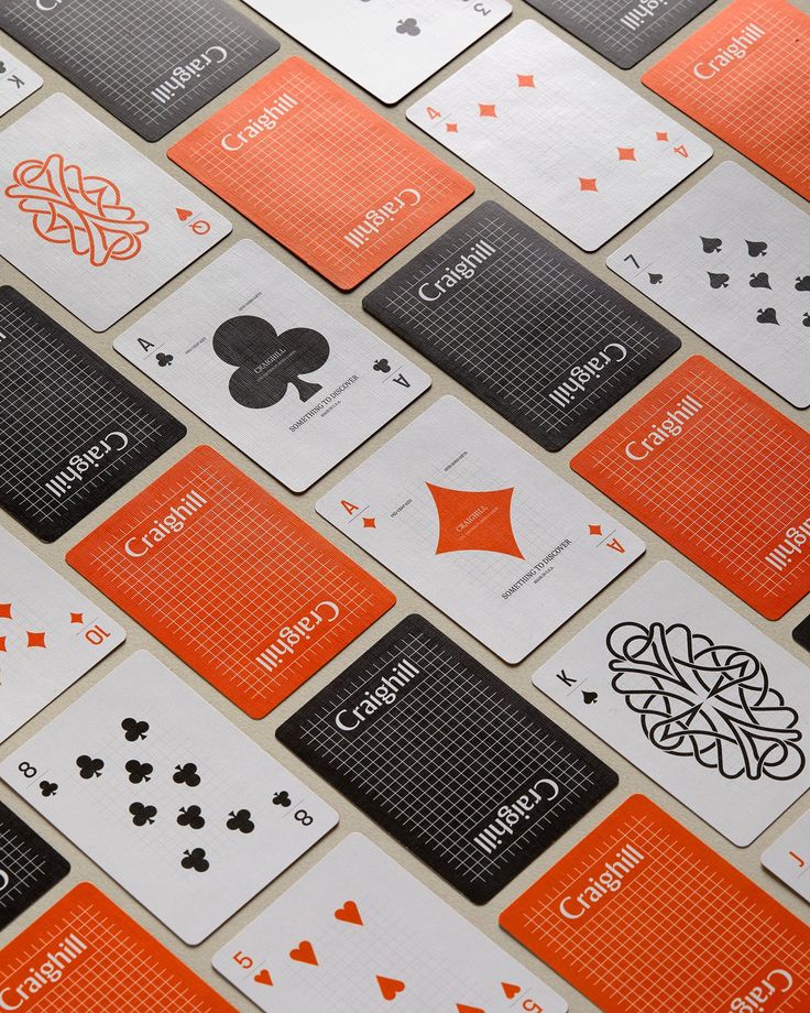 an orange and black playing card pattern